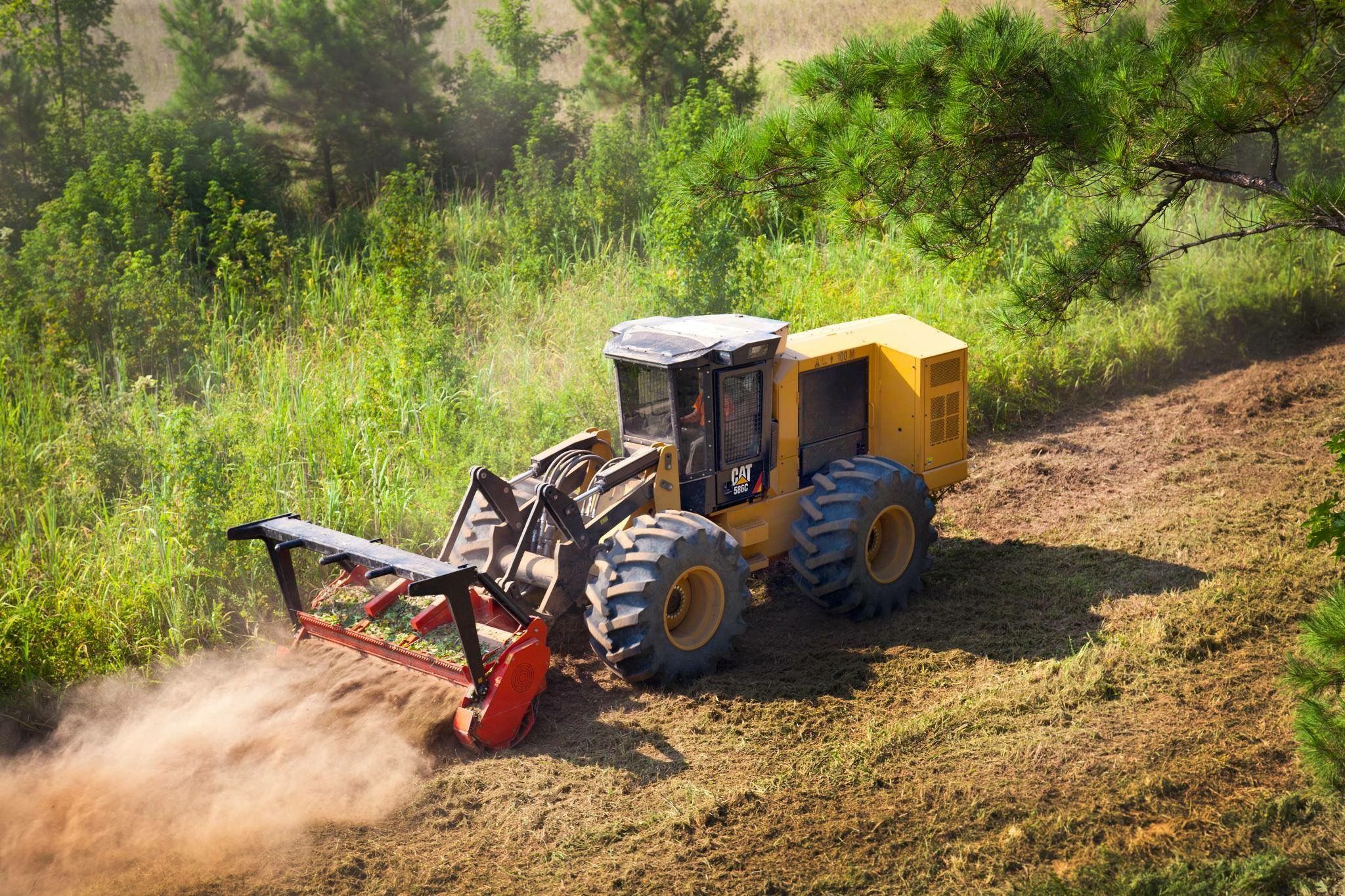 Forestry mulcher clearing brush on a residential lot in The Woodlands Texas